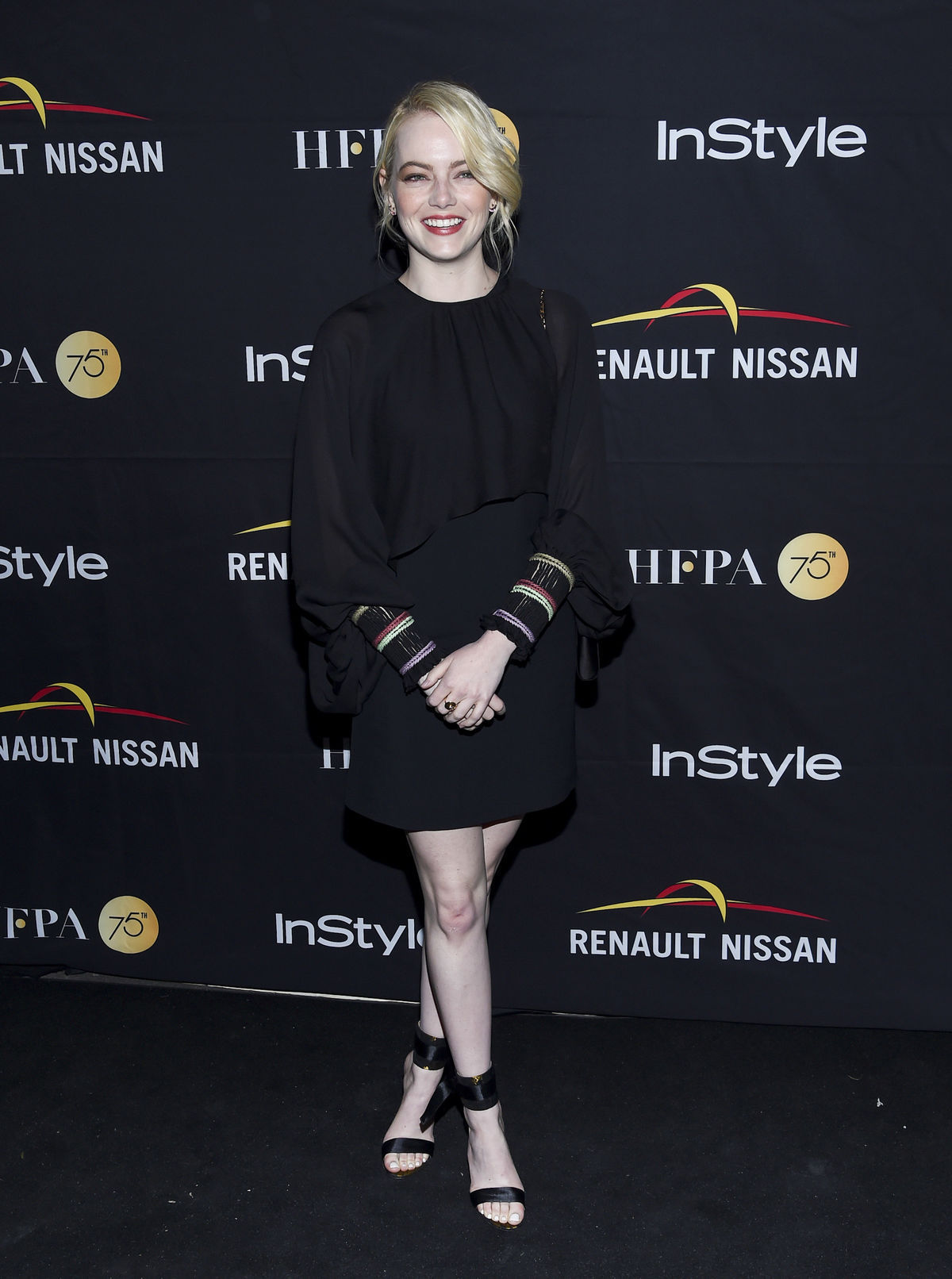Herečka Emma Stone prišla na akciu v šatách Chloe.