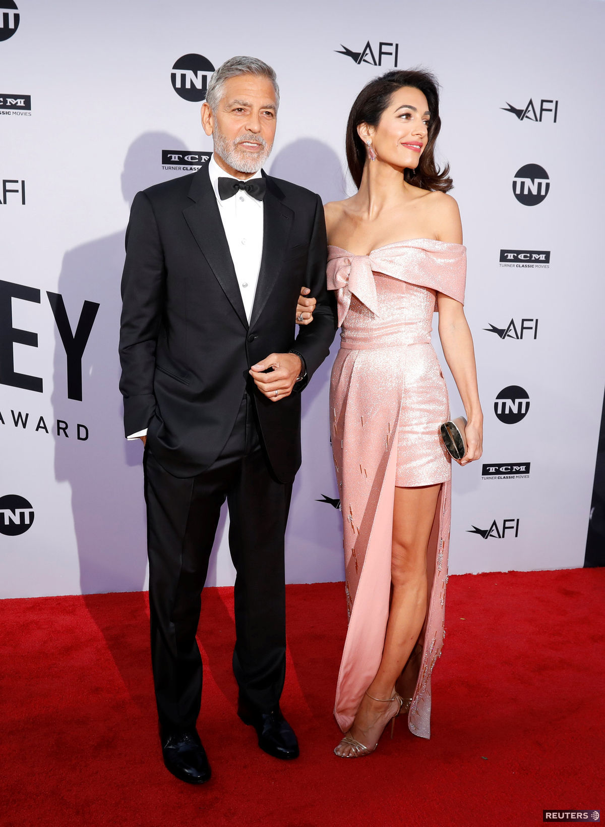 Herec George Clooney a jeho manželka Amal...