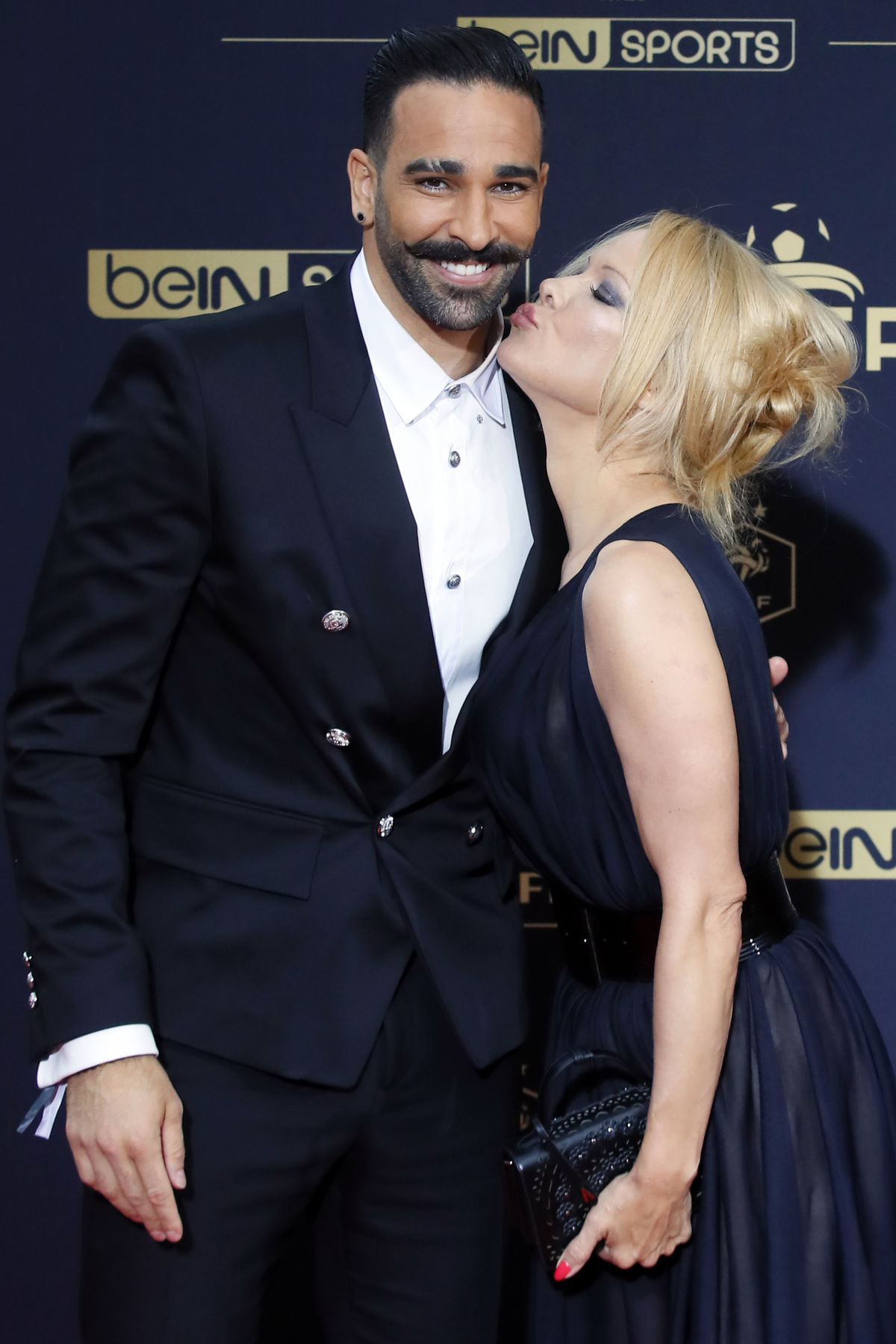Futbalista Adil Rami a americká herečka Pamela...