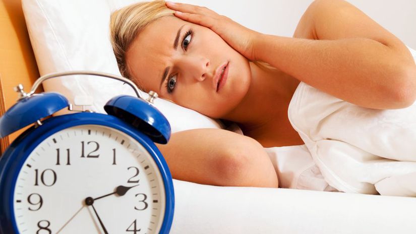 Clock with sleep at night. Woman can not sleep.