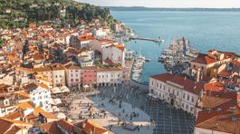 Beautiful aerial view on Piran town with Tartini main square, ancient buildings with red roofs and Adriatic sea in southwestern Slovenia