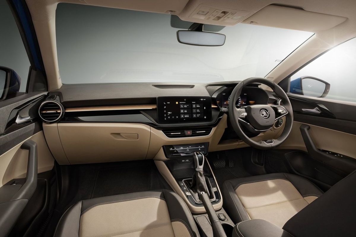 The interior is reminiscent of the new Fabia.  See ...