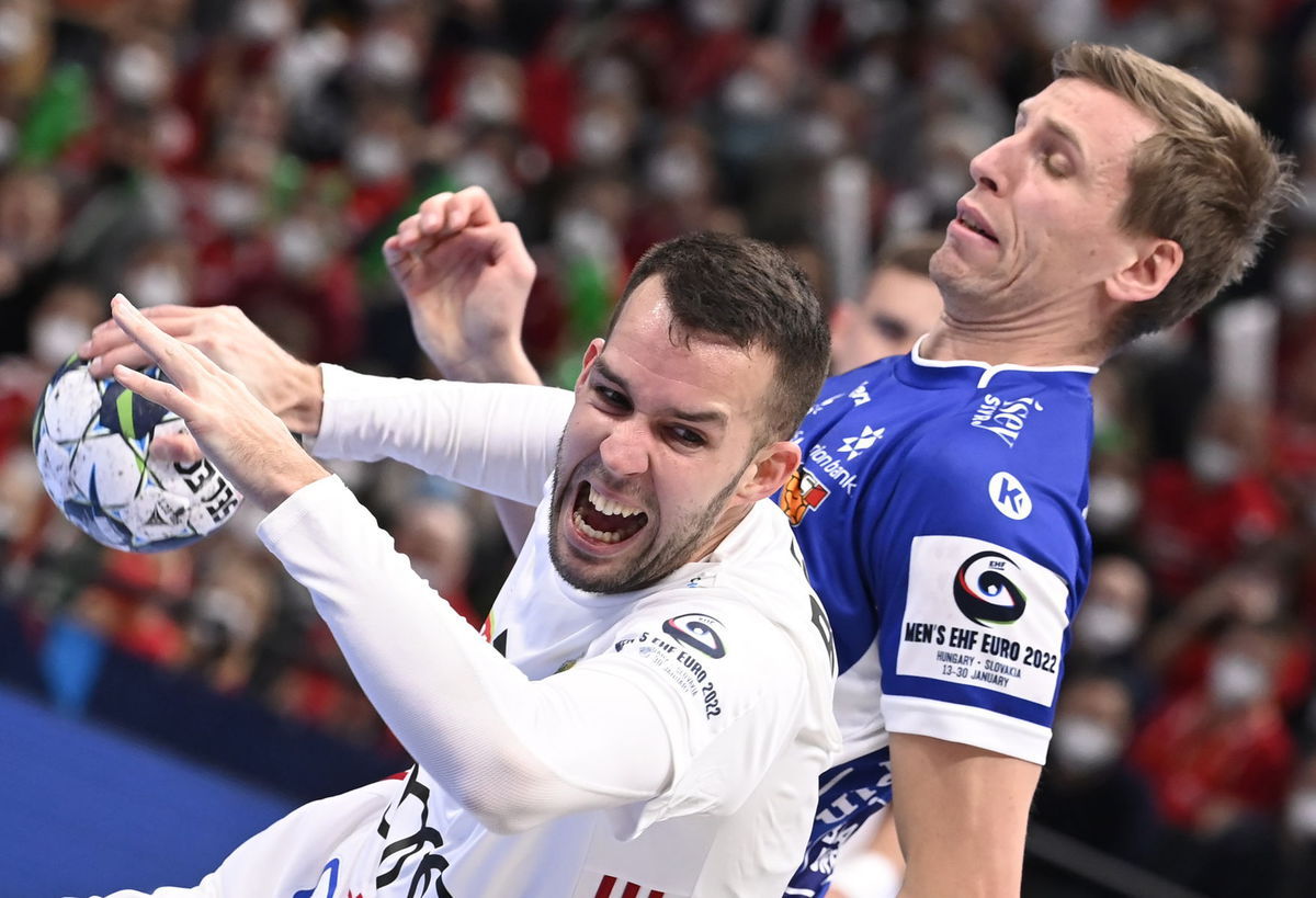 Hungarian handball player Bendegúz Bóka is trying to cross ...