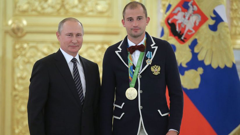 Vladimir Putin a Alexander Lesun po zisku zlata...