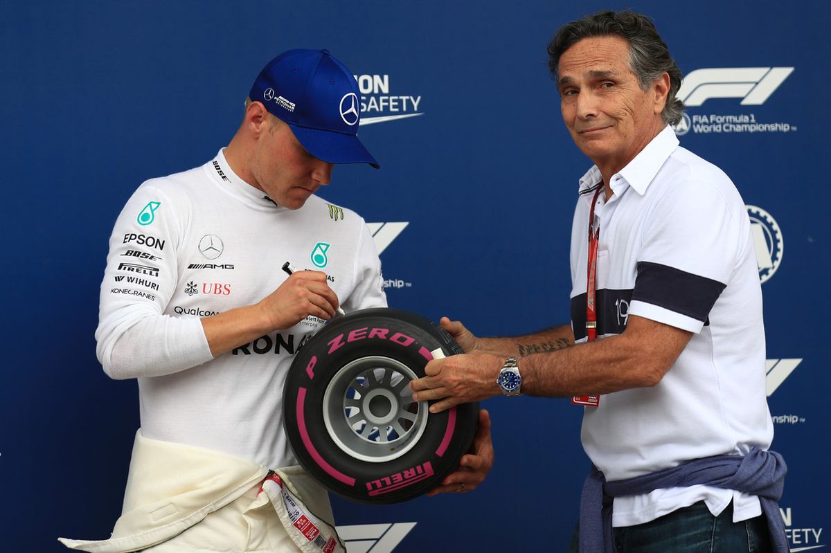 Nelson Piquet (vľavo) s Valtteri Bottasom na...