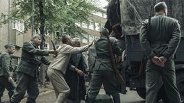 German soldiers forcibly load Jewish people onto trucks in Amsterdam, as seen in A SMALL LIGHT. (National Geographic for Disney/Dusan Martincek)
