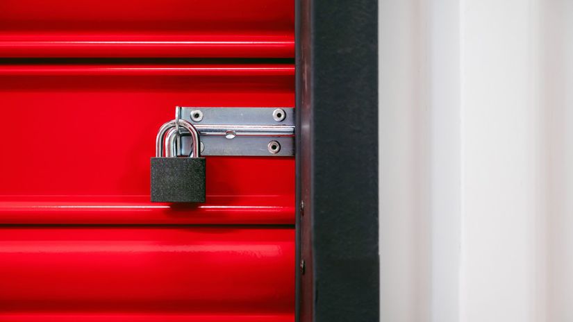 Padlock of self storage door with red door