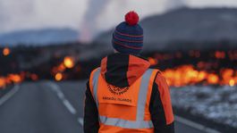 A University of Iceland scientist observes the lava...