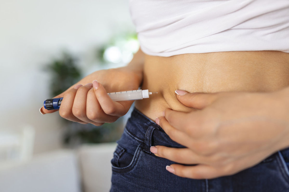 A diabetic patient using insulin pen for making...